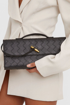 Melanie | Cartera de mano con lazo dorado